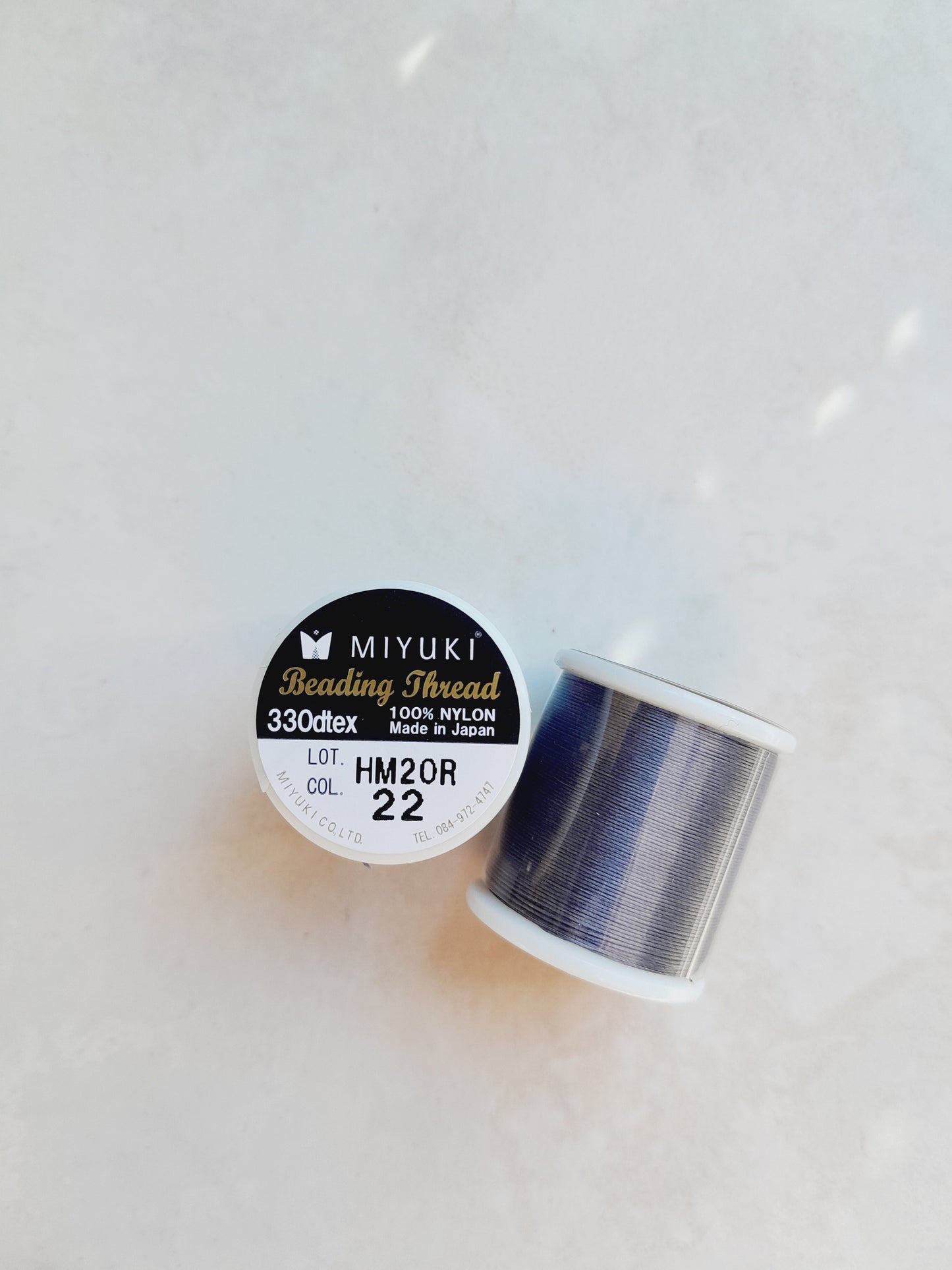 1 bobine de 50m fil nylon MIYUKI couleur Grey 22