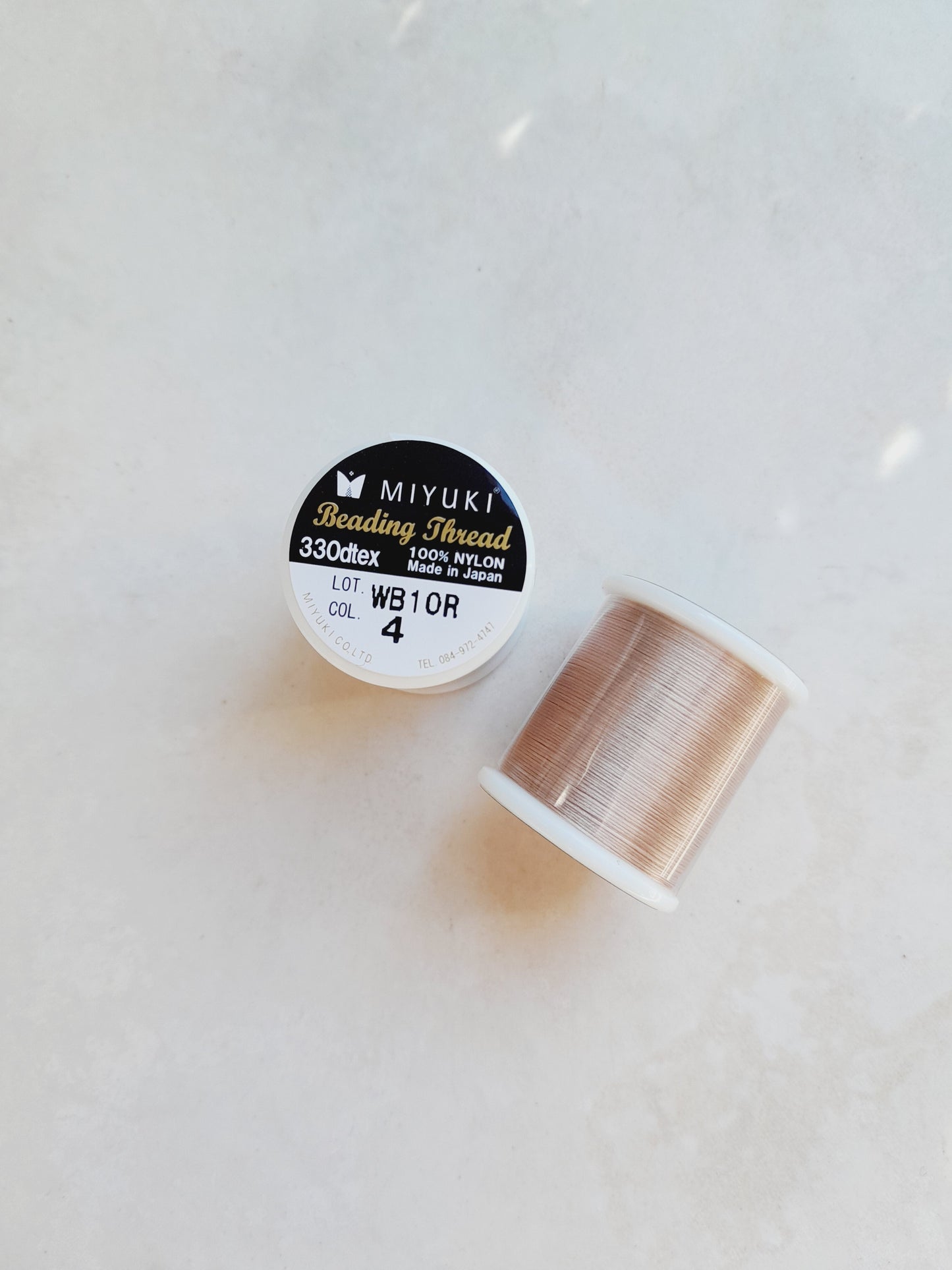 1 bobine de 50m fil nylon MIYUKI couleur brun clair, rosé 4