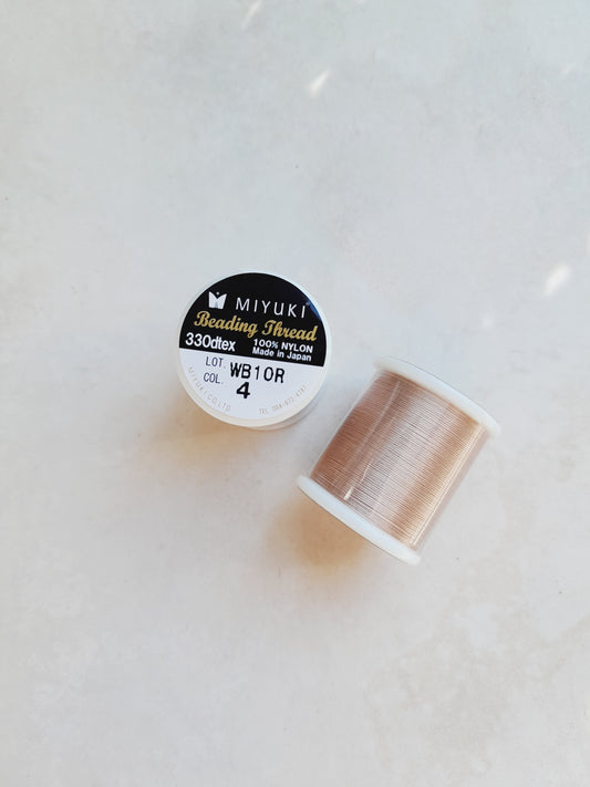 1 bobine de 50m fil nylon MIYUKI couleur brun clair, rosé 4